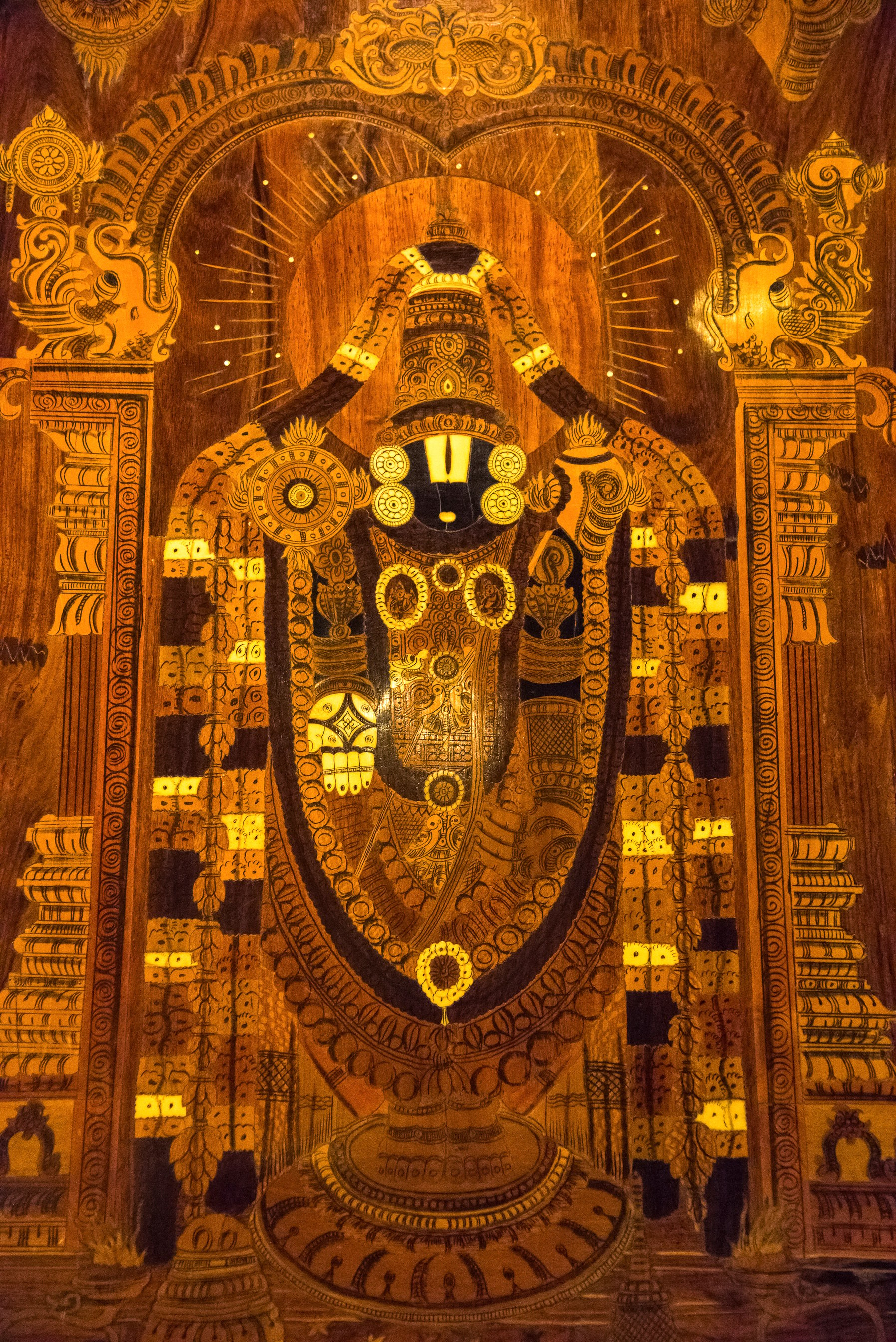 Wooden painting of Lord Tirupathi at hotel lobby, Kumbakonam, Tamil Nadu, India